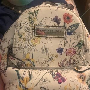 Mini backpack it has 5 pockets inside